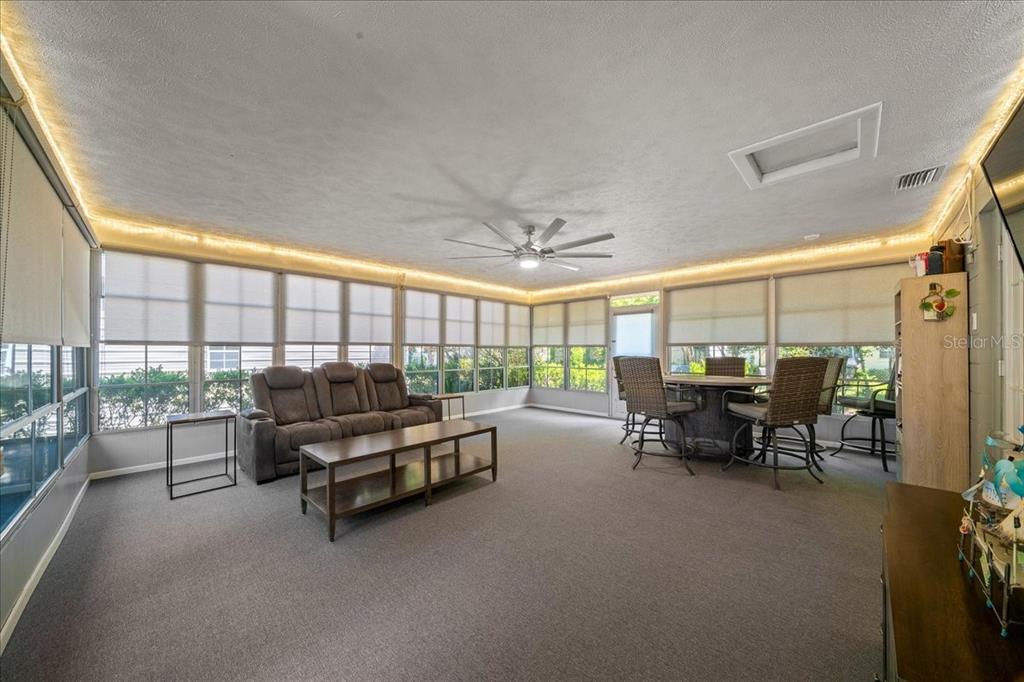 4367 Northeast 11th Street Ocala, FL 34470 - Photo 18 of 24 a living room with furniture and a flat screen tv