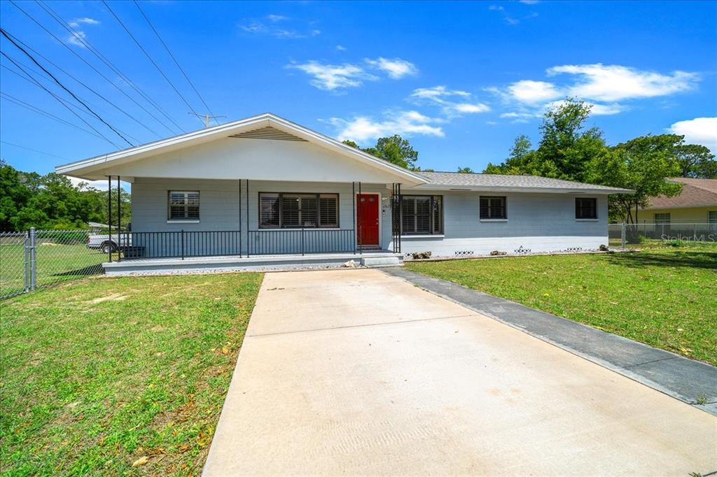 4367 Northeast 11th Street Ocala, FL 34470 - Photo 2 of 24 a front view of house with yard and green space