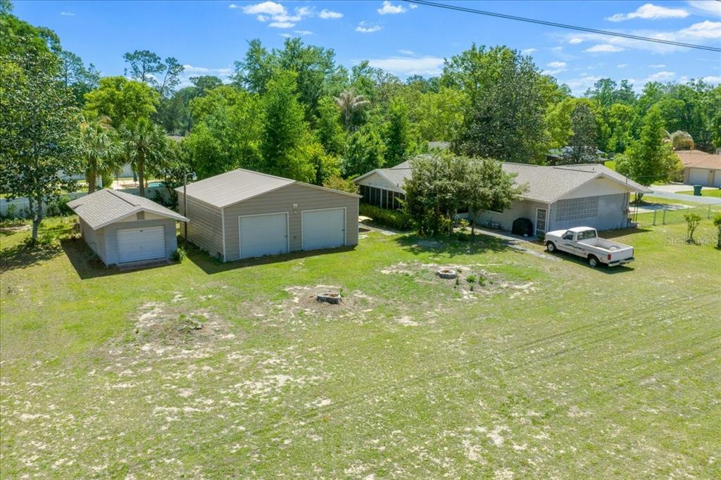 4367 Northeast 11th Street Ocala, FL 34470 - Photo 22 of 24 a view of backyard with swimming pool and trees in the background