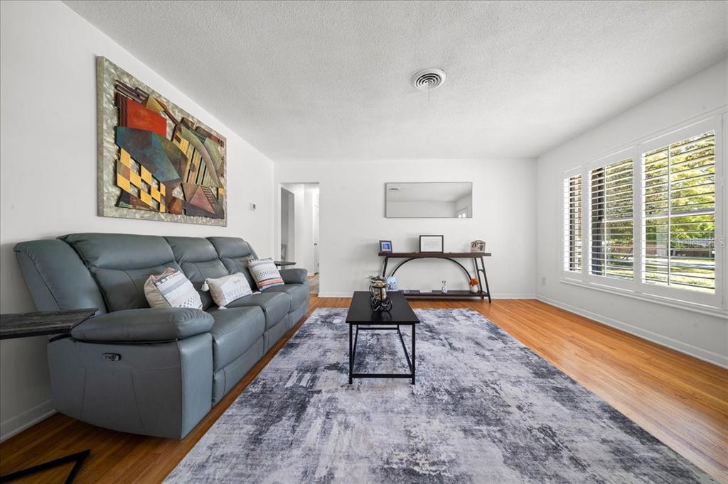 4367 Northeast 11th Street Ocala, FL 34470 - Photo 6 of 24 a living room with furniture and a large window