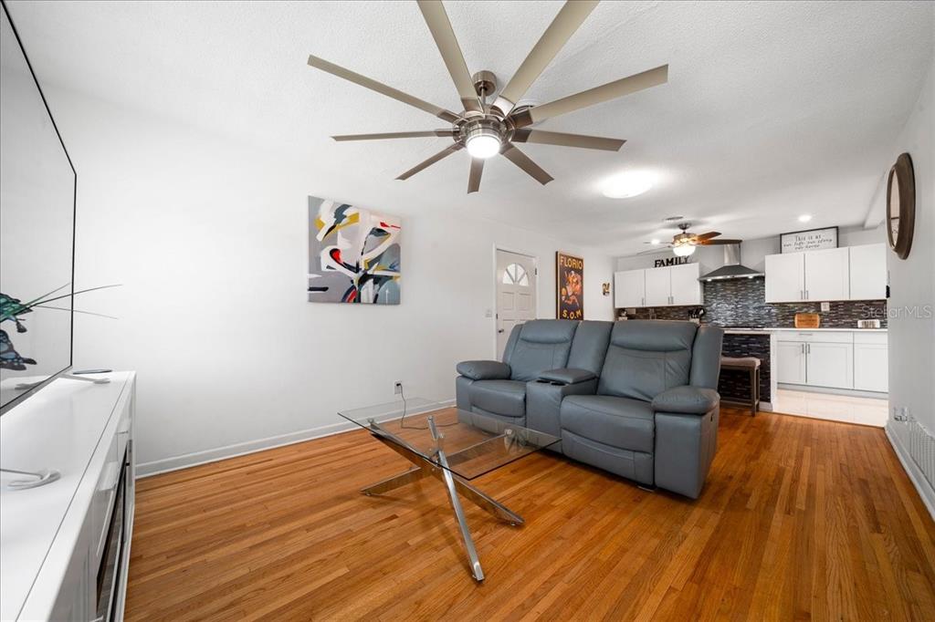 4367 Northeast 11th Street Ocala, FL 34470 - Photo 7 of 24 a living room with furniture and kitchen view