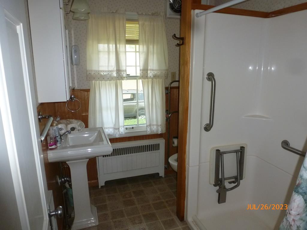 920 Innis St Extension Oil City, PA 16301 - Photo 12 of 21 a bathroom with a sink a toilet and tub