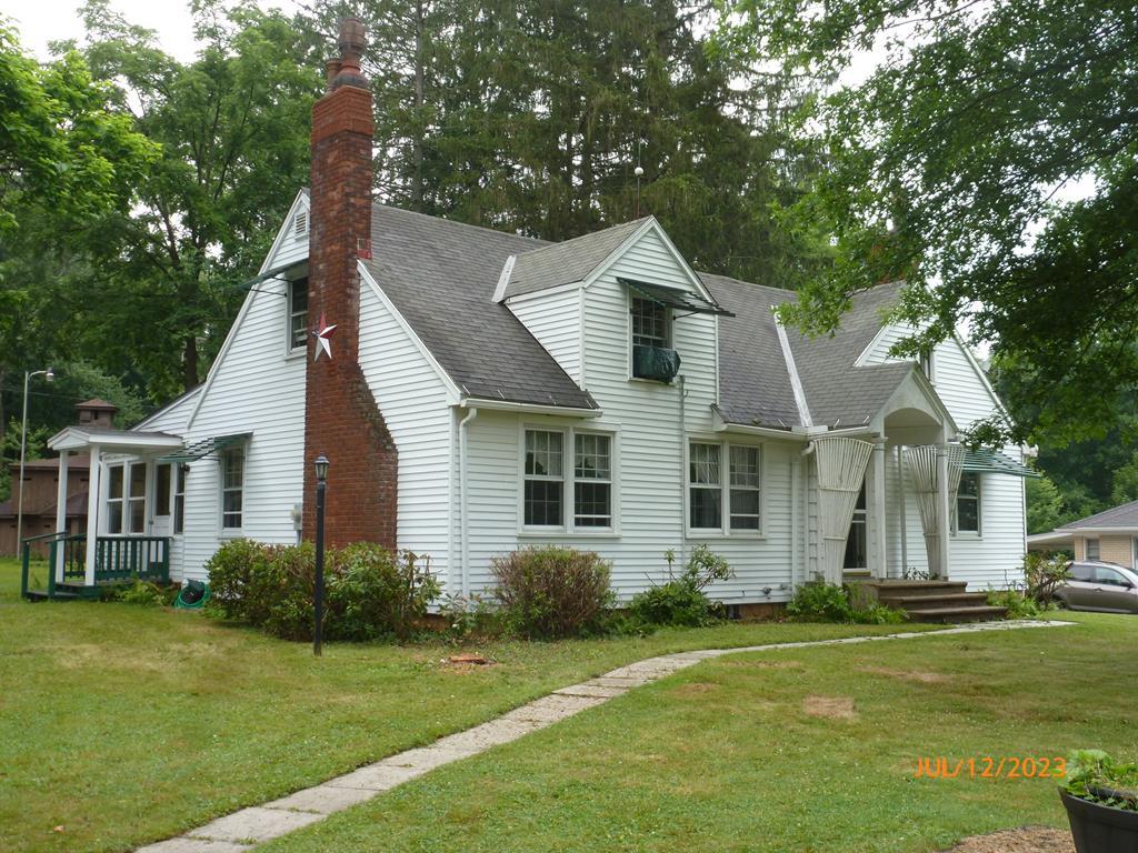 920 Innis St Extension Oil City, PA 16301 - Photo 2 of 21 a front view of a house with a yard