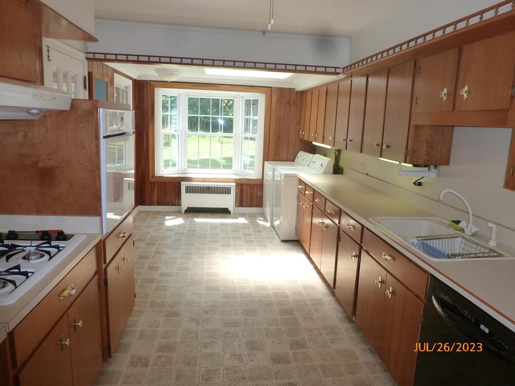 920 Innis St Extension Oil City, PA 16301 - Photo 9 of 21 a kitchen with stainless steel appliances granite countertop a sink stove and cabinets