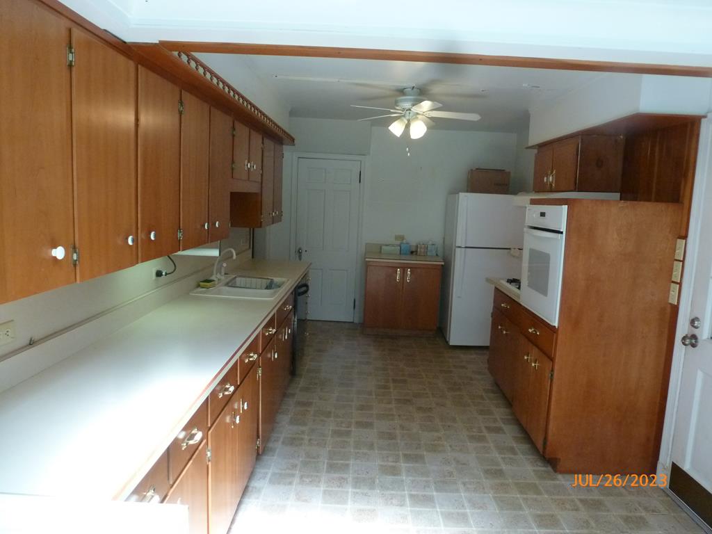920 Innis St Extension Oil City, PA 16301 - Photo 10 of 21 a kitchen with stainless steel appliances a sink and a refrigerator