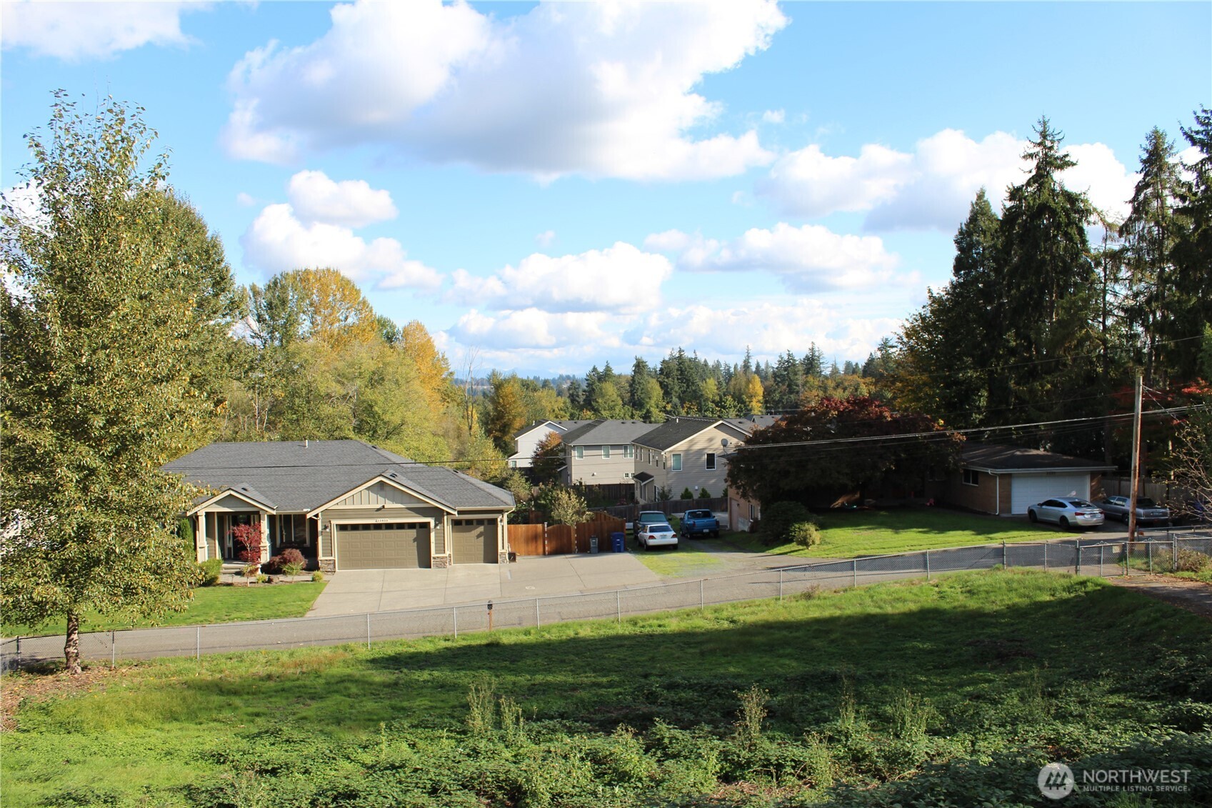 23032 7th Avenue Southeast Bothell, WA 98021 - Photo 8 of 24 a view of house with garden and tall trees