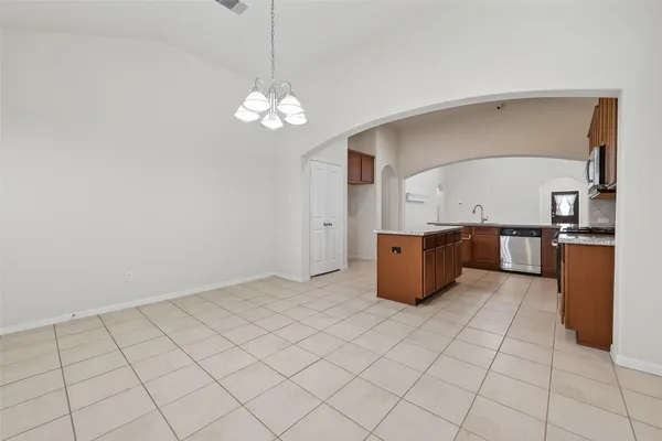 a kitchen with stainless steel appliances granite countertop a stove and a sink