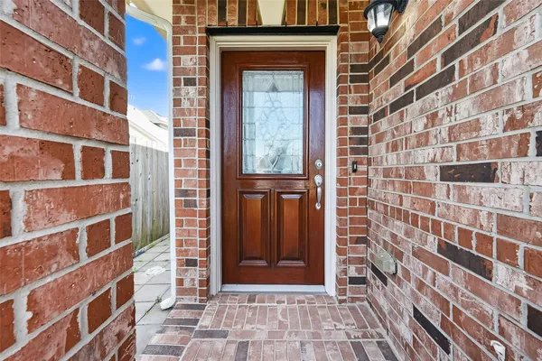 a view of a kitchen with furniture and a ceiling fan