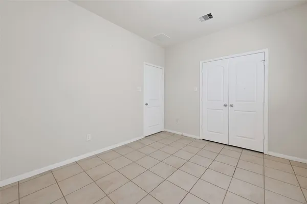 a front view of house with a garden and patio