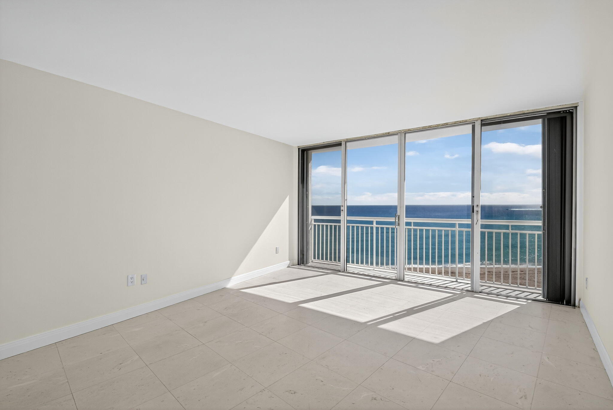 2780 South Ocean Boulevard, Unit 703 Palm Beach, FL 33480 - Photo 14 of 44 a view of an empty room with a balcony