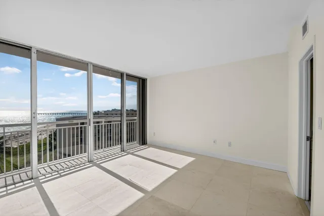 a view of balcony with wooden floor