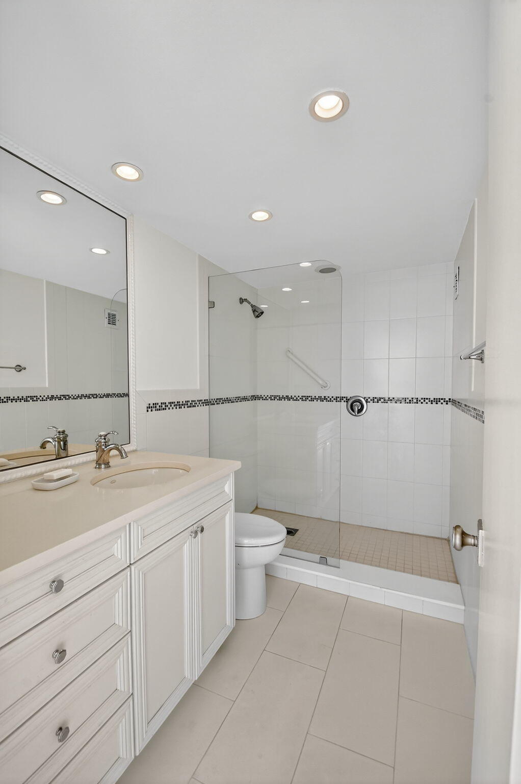 2780 South Ocean Boulevard, Unit 703 Palm Beach, FL 33480 - Photo 26 of 44 a view of a bathroom with a granite countertop sink a toilet and a shower