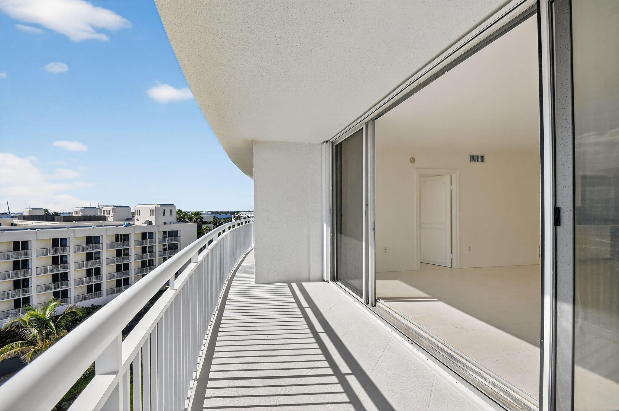 2780 South Ocean Boulevard, Unit 703 Palm Beach, FL 33480 - Photo 39 of 44 a view of balcony and wooden floor