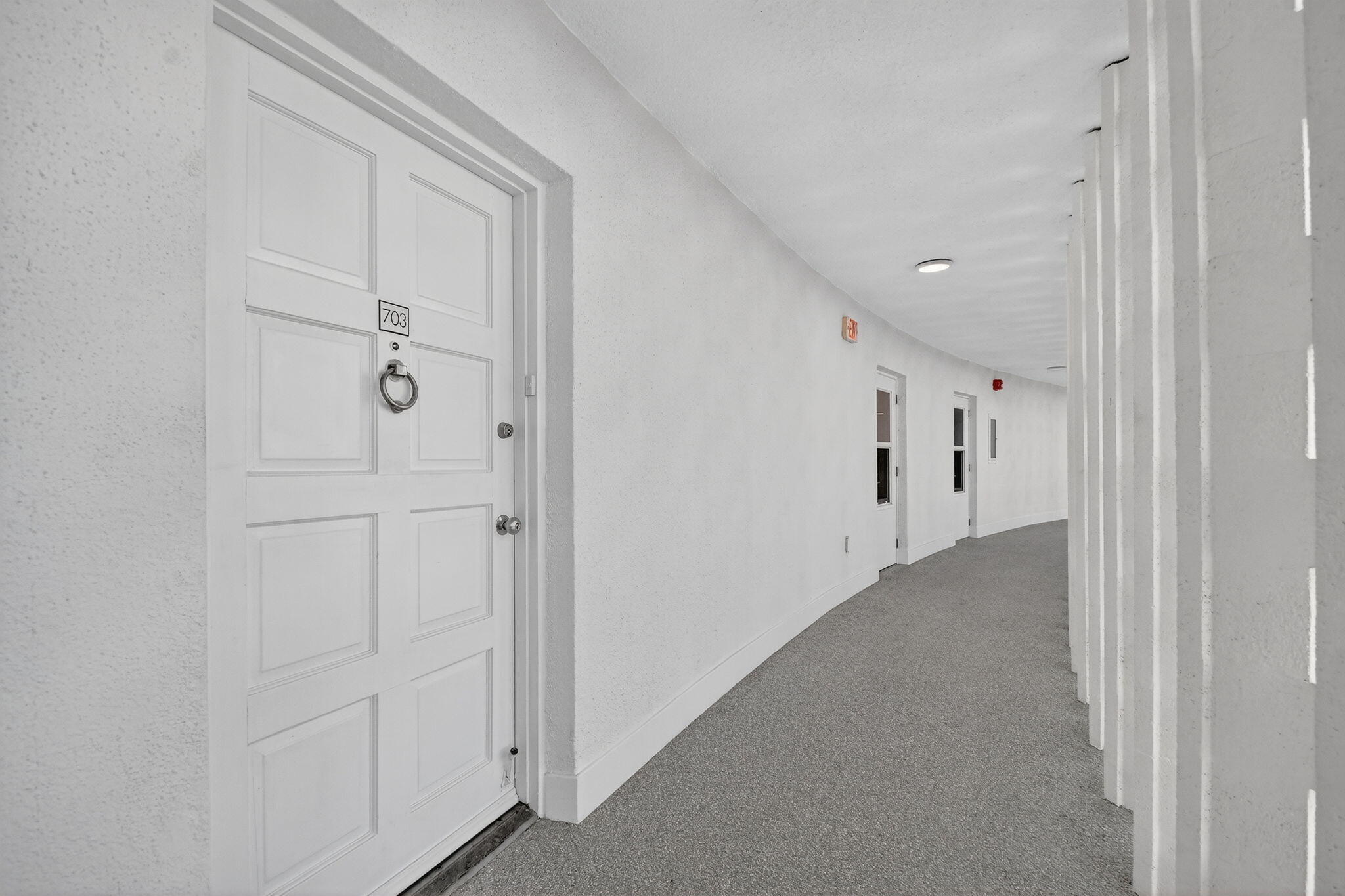 2780 South Ocean Boulevard, Unit 703 Palm Beach, FL 33480 - Photo 40 of 44 a view of a hallway with white walls