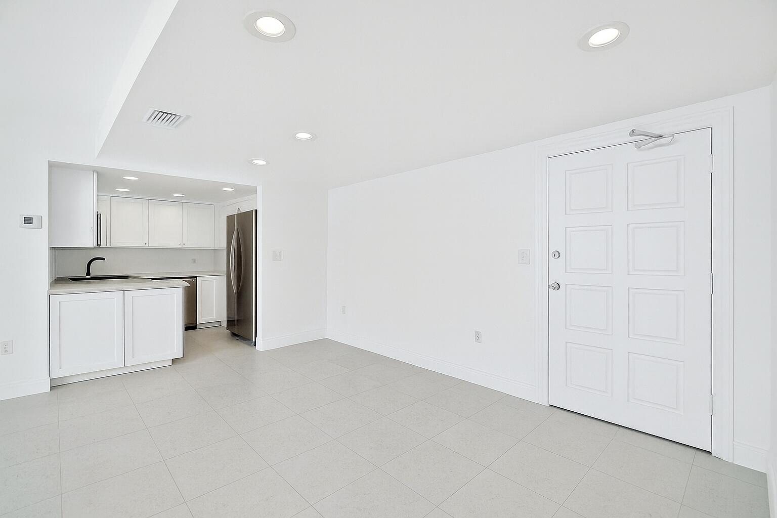 2780 South Ocean Boulevard, Unit 703 Palm Beach, FL 33480 - Photo 42 of 44 a view of an empty room with kitchen and a sink