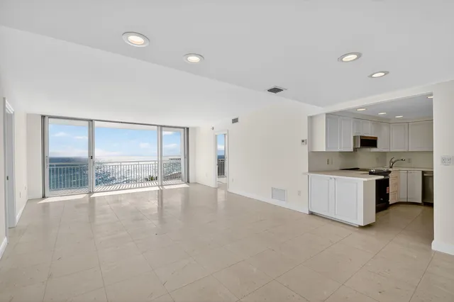 a bathroom with a double vanity sink mirror and shower