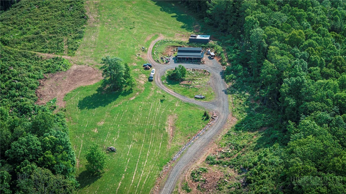509 Grant Houck Road Todd, NC 28684 - Photo 12 of 43 an aerial view of residential house with outdoor space and trees all around