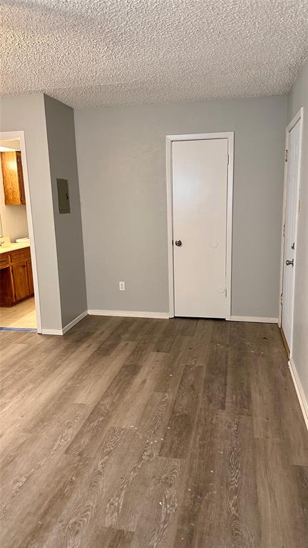 3812 Stuart Road Denton, TX 76209 - Photo 7 of 9 a view of an empty room and wooden floor