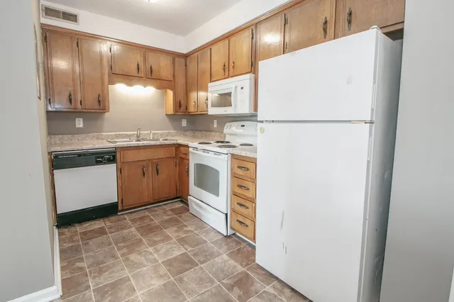 a view of a kitchen with a sink