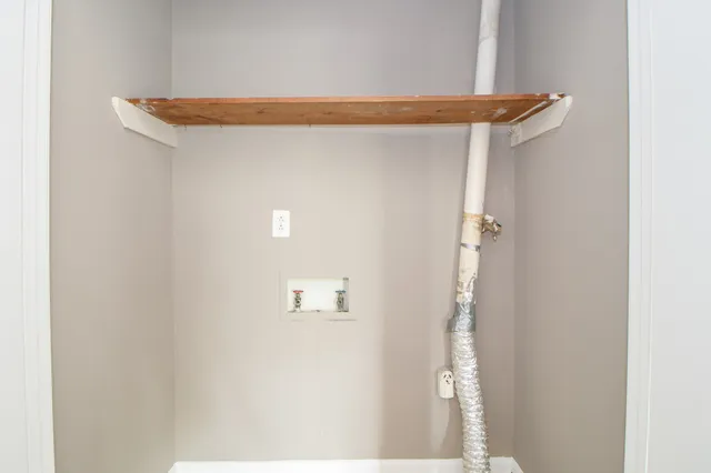 a bathroom with a toilet and bathtub