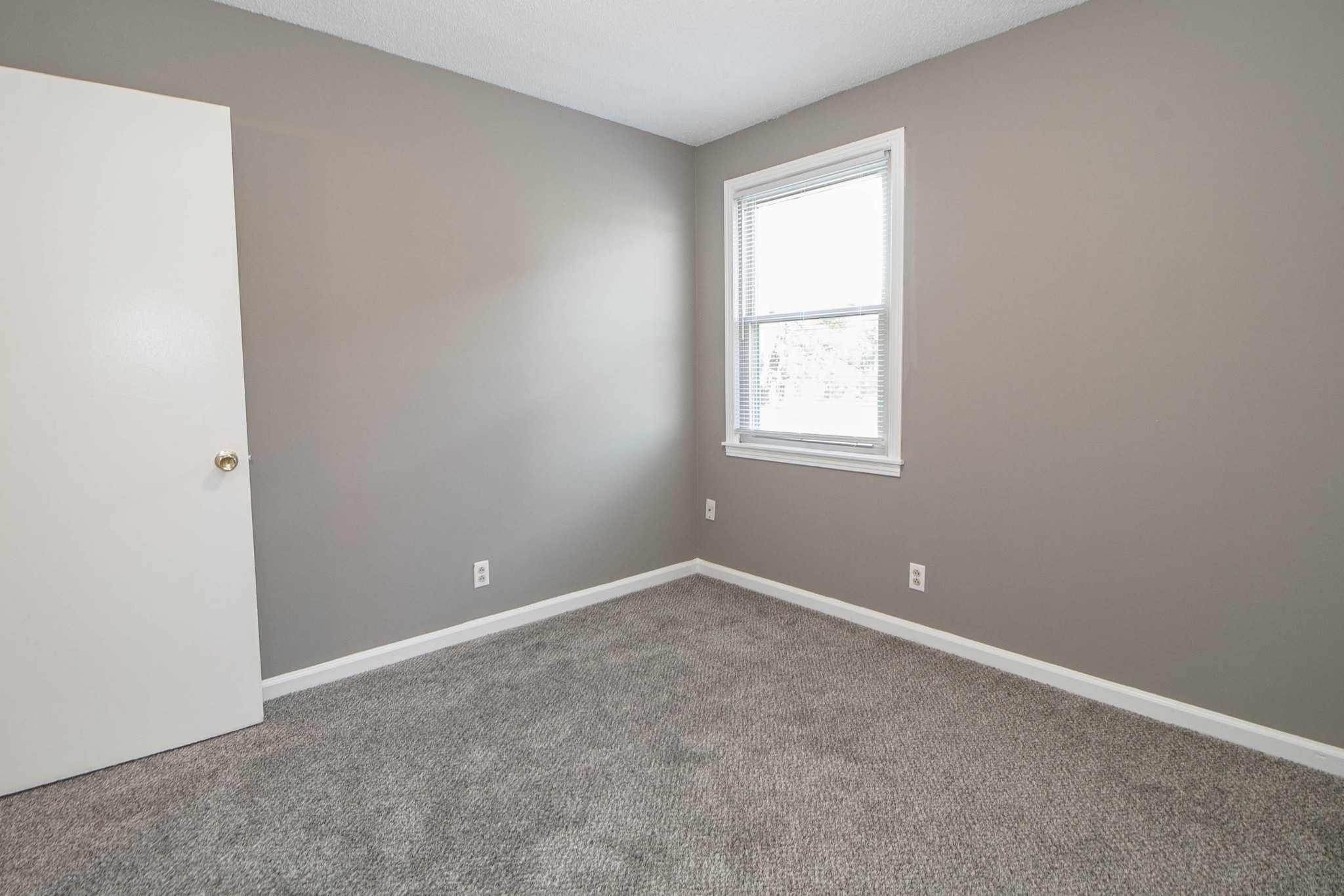 807 Golf View Place, Unit C Clarksville, TN 37043 - Photo 19 of 24 an empty room with windows and closet