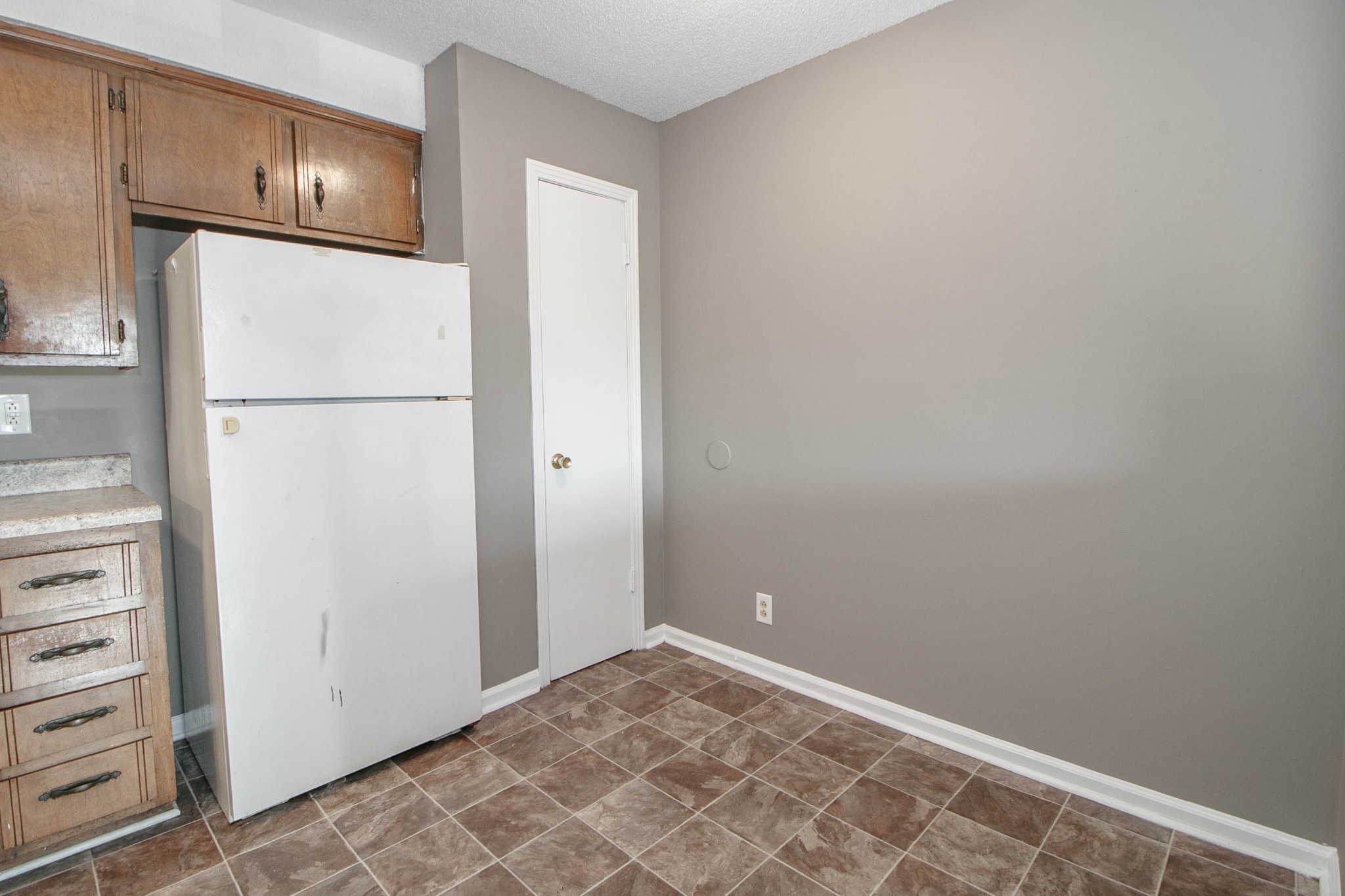 807 Golf View Place, Unit C Clarksville, TN 37043 - Photo 9 of 24 a view of a refrigerator in kitchen and white cabinets