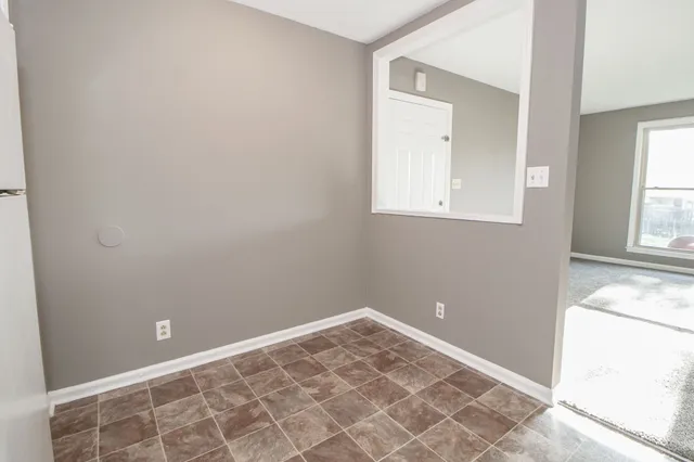 a kitchen with stainless steel appliances granite countertop a stove a refrigerator and a sink