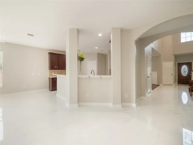 a view of a kitchen with a sink and a stove top oven