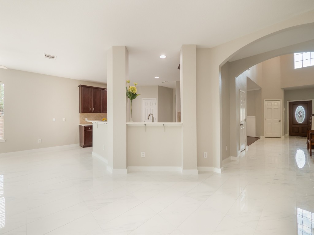 406 Primavera Loop Kyle, TX 78640 - Photo 12 of 38 a view of a kitchen with a sink and a stove top oven