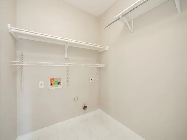 a view of entryway and hall with a workspace