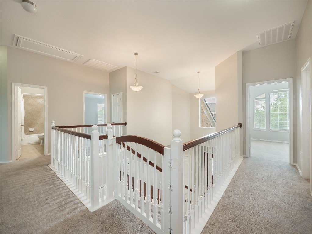 406 Primavera Loop Kyle, TX 78640 - Photo 24 of 38 a view of an entryway wooden floor
