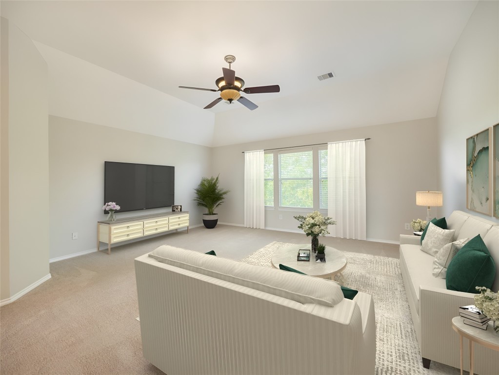 406 Primavera Loop Kyle, TX 78640 - Photo 25 of 38 a living room with furniture and a flat screen tv