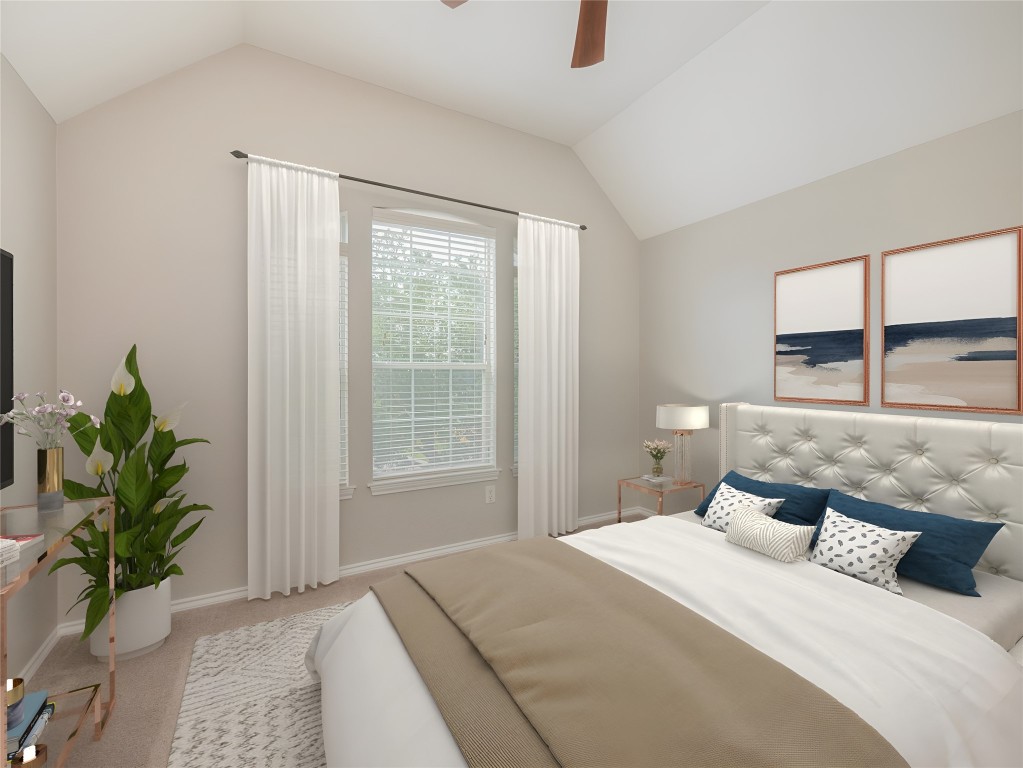 406 Primavera Loop Kyle, TX 78640 - Photo 27 of 38 a bedroom with a large bed and a potted plant