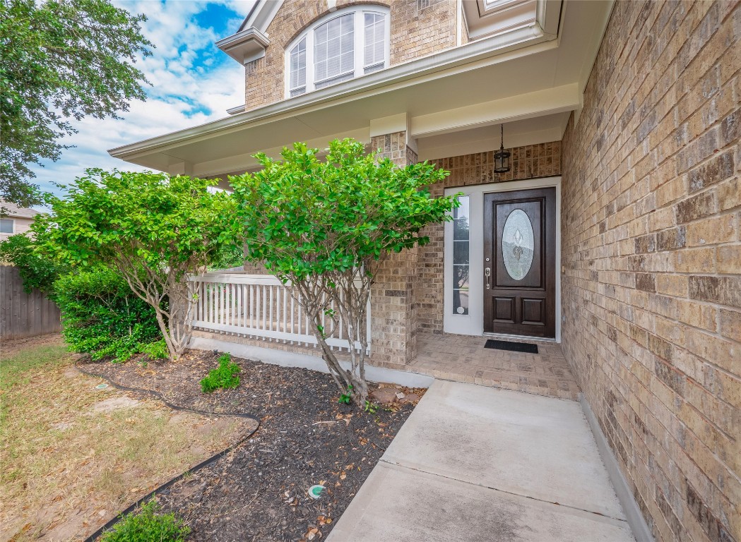 406 Primavera Loop Kyle, TX 78640 - Photo 3 of 38 a front view of a house with garden