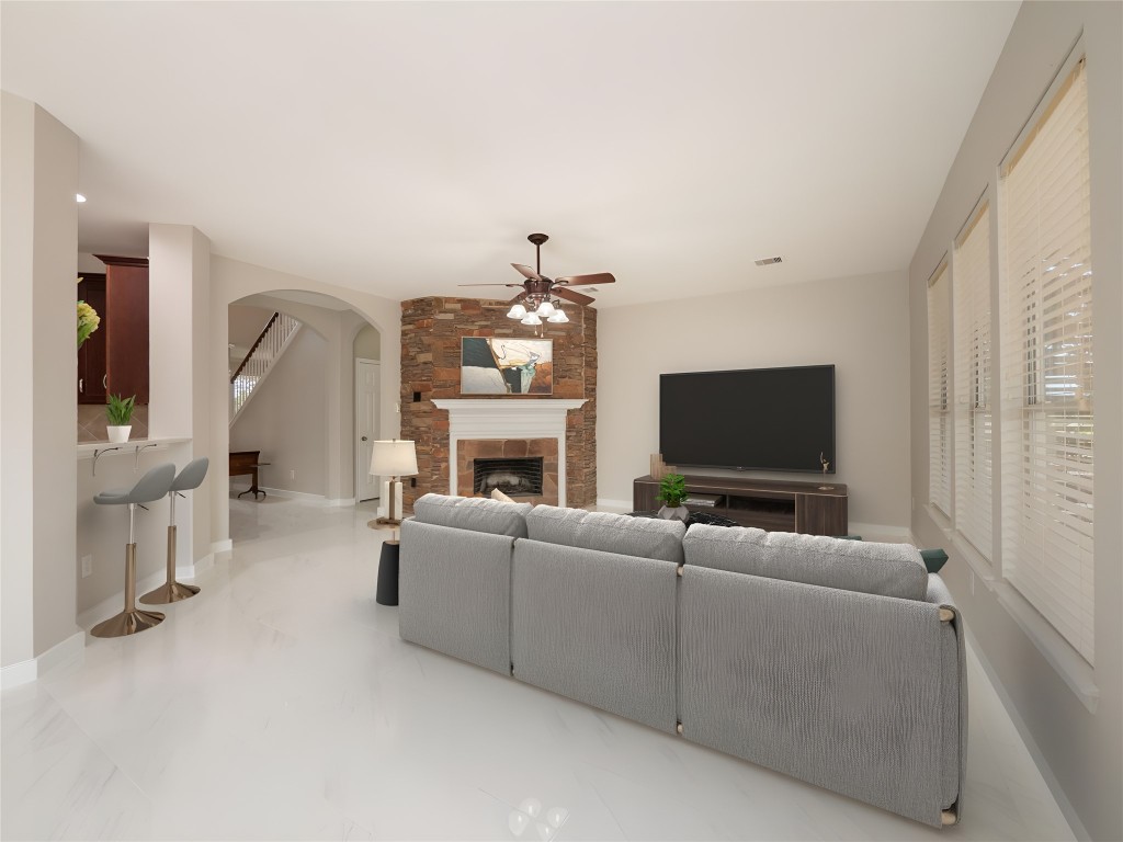 406 Primavera Loop Kyle, TX 78640 - Photo 8 of 38 a living room with furniture and a flat screen tv