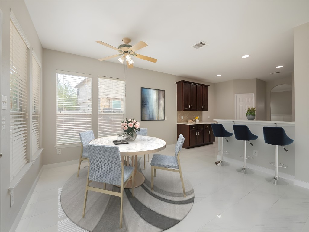 406 Primavera Loop Kyle, TX 78640 - Photo 10 of 38 a view of a dining room with furniture
