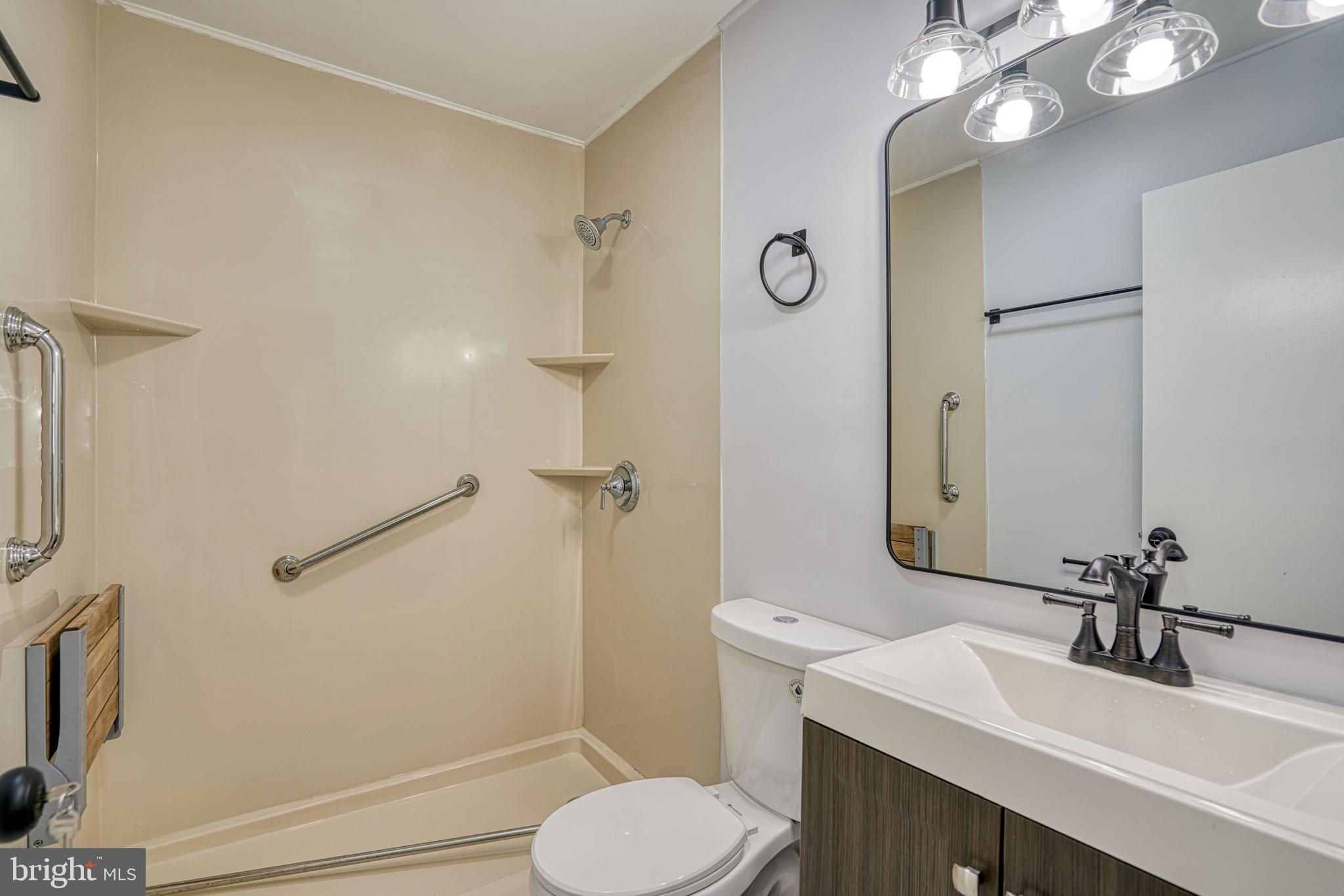 10 Bay View Avenue Cambridge, MD 21613 - Photo 22 of 28 a bathroom with a sink toilet and shower