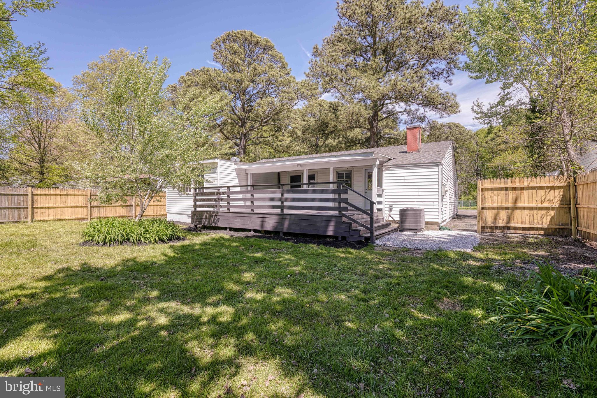 10 Bay View Avenue Cambridge, MD 21613 - Photo 23 of 28 a view of a backyard with a garden and entertaining space