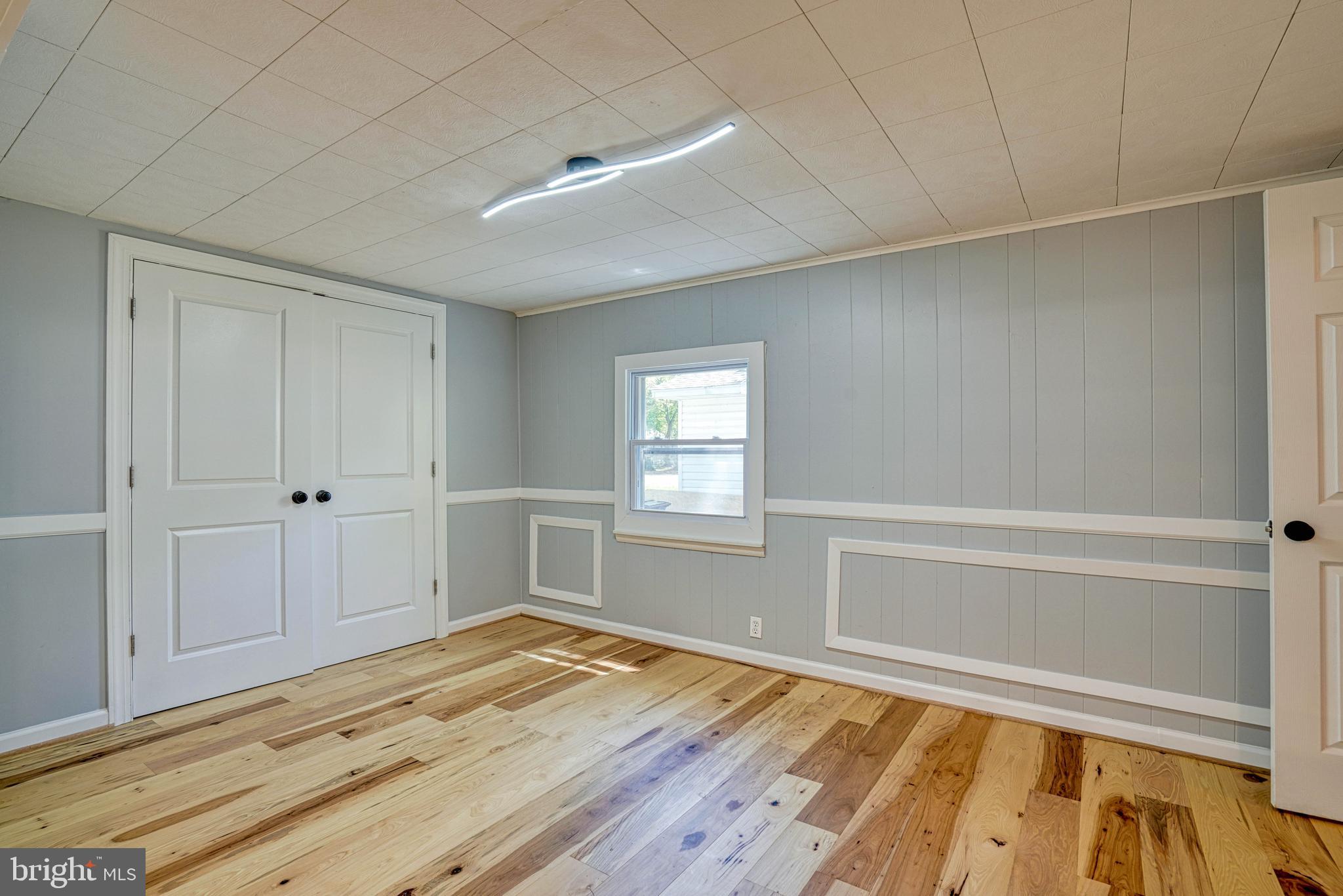 10 Bay View Avenue Cambridge, MD 21613 - Photo 8 of 28 a view of empty room with wooden floor and fan