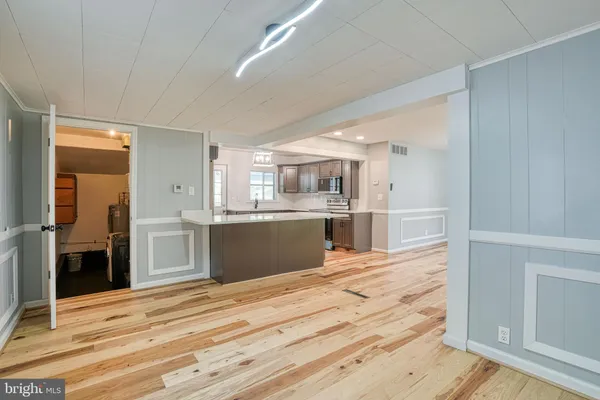 a kitchen with a refrigerator and a sink