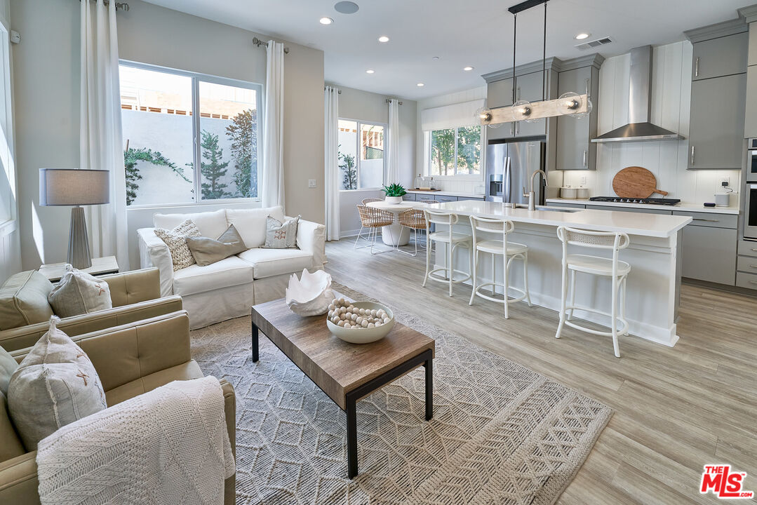 525 Daniel Freeman Circle Inglewood, CA 90301 - Photo 2 of 39 a living room with furniture wooden floor and a large window