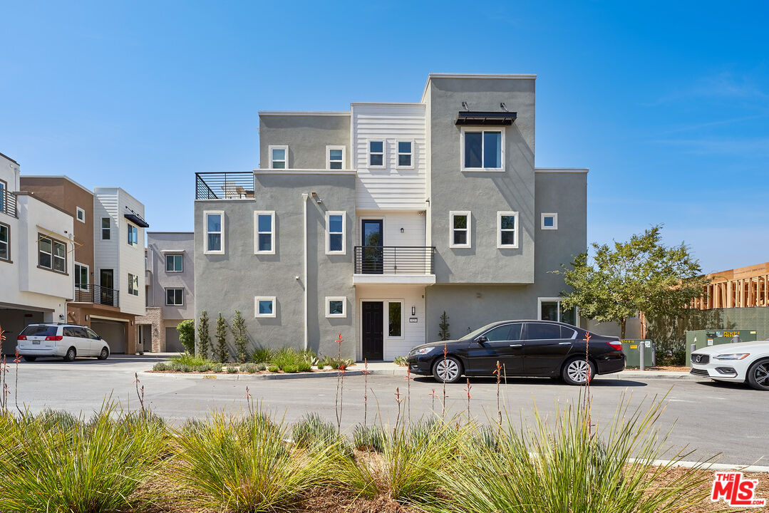 525 Daniel Freeman Circle Inglewood, CA 90301 - Photo 39 of 39 a front view of a house with a yard and car parked