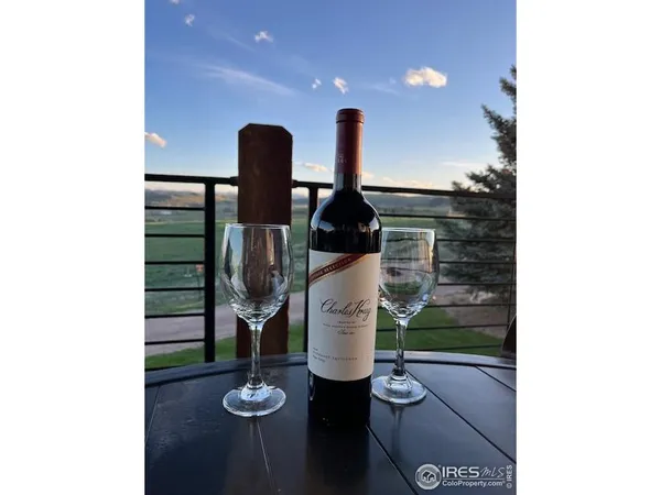 a view of deck with seating space and wooden floor