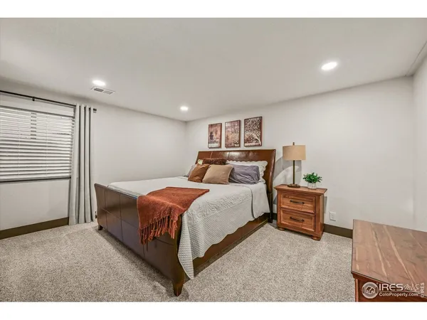 a bathroom with a toilet a sink and a mirror