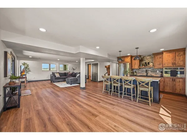 a patio with glass top table and chairs