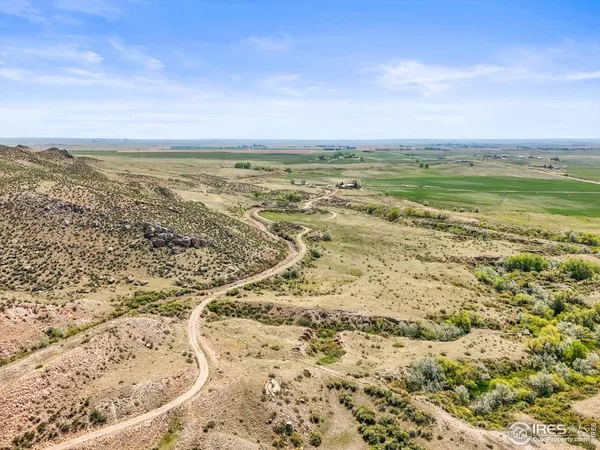 a view of multiple houses with a yard