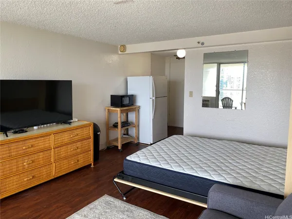 a bedroom with a bed and furniture