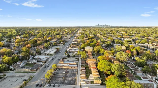 an aerial view of residential building and ocean view