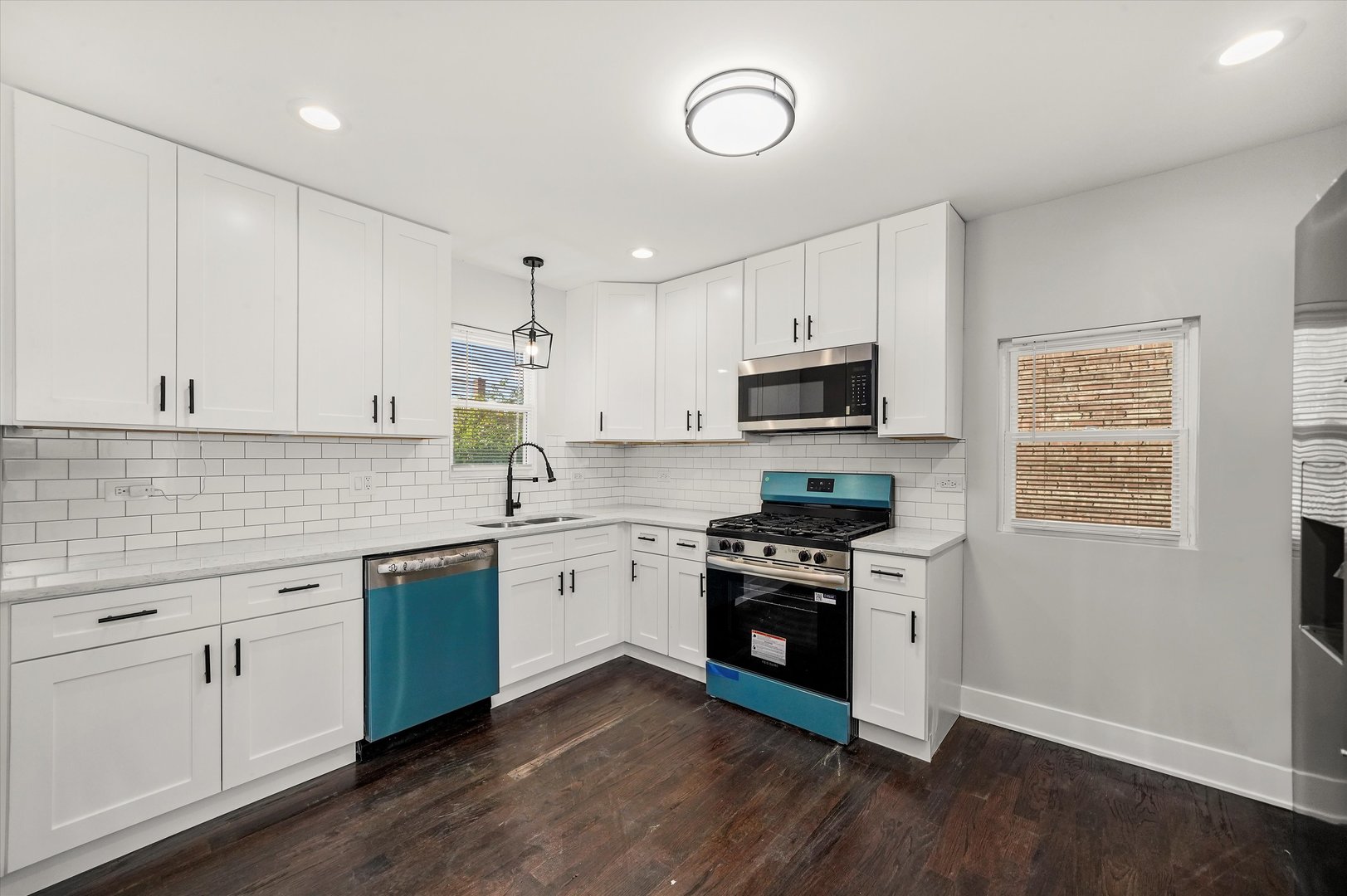 9322 South Justine Street Chicago, IL 60620 - Photo 6 of 27 a kitchen with granite countertop a sink cabinets and stainless steel appliances