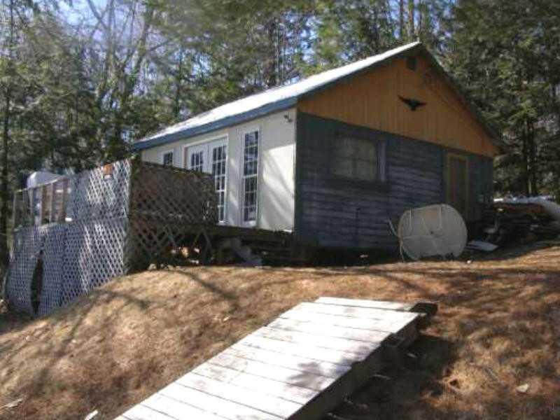 156 Loon Cove Road Hartland, ME 04943 - Photo 1 of 3 Exterior Front. front facing pond
